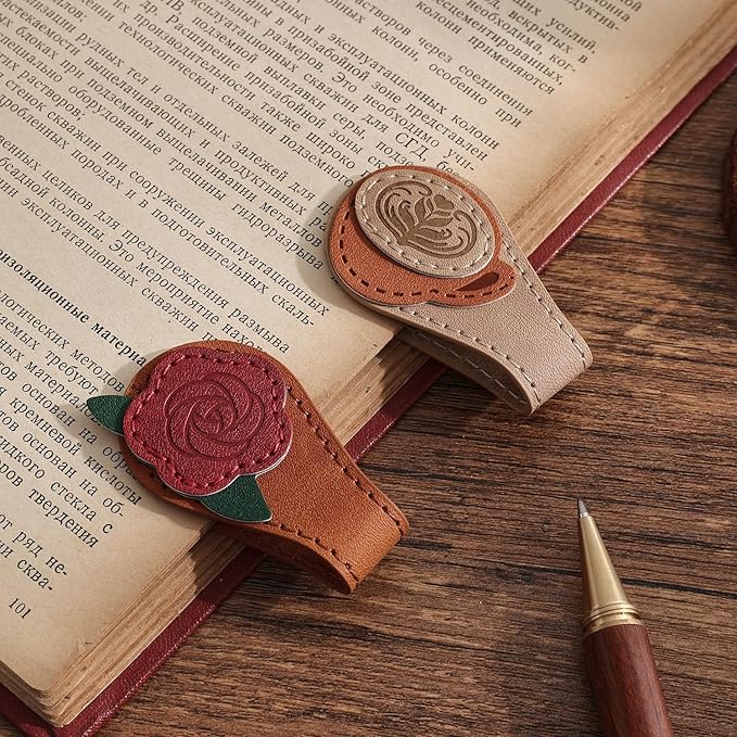 A set of leather magnetic bookmarks.